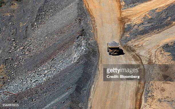 Mining truck carries diamond-bearing kimberlite rock to a processing facility after being cut from the base of the Jwaneng mine, operated by the...