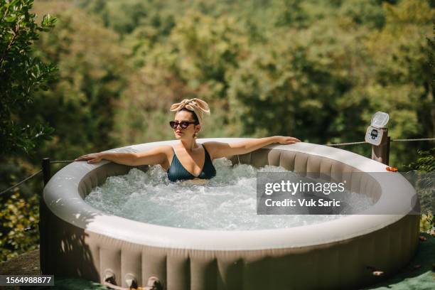 enjoying in hot tub - hot tub stock pictures, royalty-free photos & images