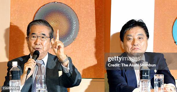 Sunrise Party joint leader Shintaro Ishikara speaks while Genzei Nippon party leader and Nagoya City mayor Takashi Kawamura listens during a press...