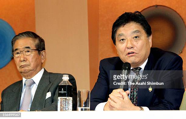 Genzei Nippon party leader and Nagoya City mayor Takashi Kawamura speaks while Sunrise Party joint leader Shintaro Ishikara listens during a press...