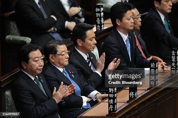 Yoshihiko Noda, Japan's prime minister, from left, Osamu Fujimura, chief cabinet secretary, Seiji Maehara, national strategy and economy minister,...
