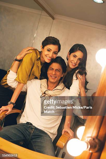 Actor Shah Rukh Khan is photographed with actors Anushka Sharma and Katrina Kaif during the press conference for the film 'Jab Tak Hai Jaan' for...
