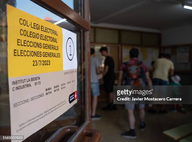 Banner for the Spanish general elections hangs on a door on July 23, 2023 in Barcelona, Spain. Voters in Spain head to the polls on July 23 to cast...