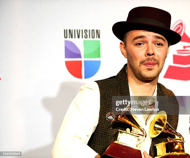 Singer Jesse Huerta of Jesse & Joy arrives at the press room for the 13th annual Latin GRAMMY Awards held at the Mandalay Bay Events Center on...