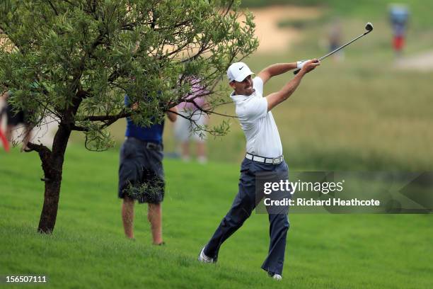 Charl Schwarztel of South Africa plays from under a tree on the 14th during the second round of the South African Open Championship at the Serengeti...