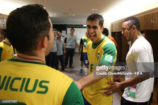 Gabriel of Brazil celebrates with team mates in the dressing room after defeating Colombia during the FIFA Futsal World Cup, Semi-Final match between...