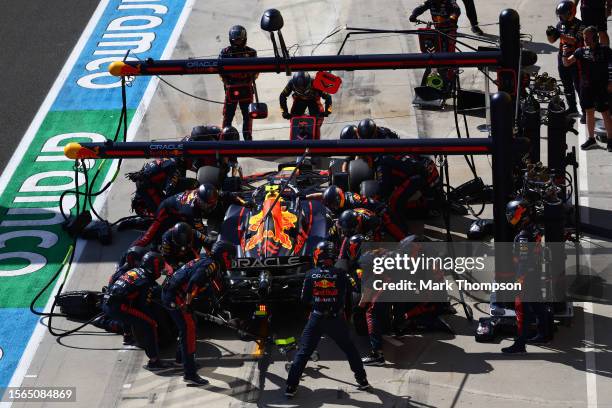 Sergio Perez of Mexico driving the Oracle Red Bull Racing RB19 makes a pitstop during the F1 Grand Prix of Hungary at Hungaroring on July 23, 2023 in...