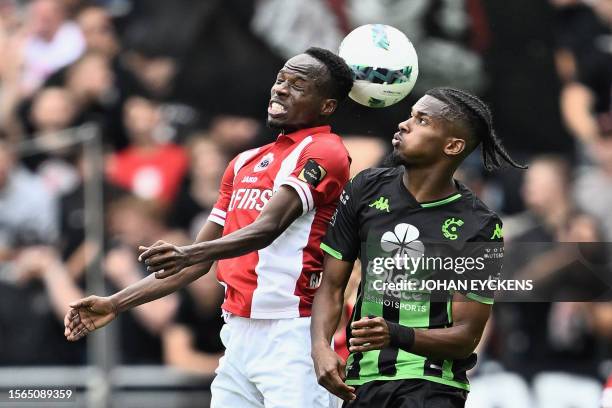 Antwerp's Nigerian midfielder Alhassan Yusuf fights for the ball with Cercle's French midfilelder Yann Gboho during the Belgian "Pro League" First...