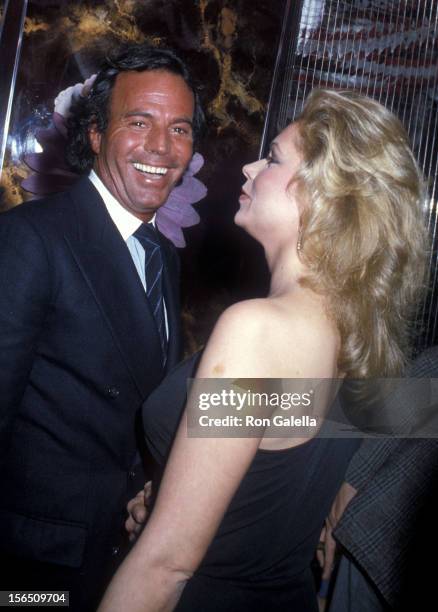Singer Julio Iglesias and singer Leonore O'Malley attend Regine Zylberberg's Pre-Valentine's Day Party on February 13, 1982 at Regine's in New York...