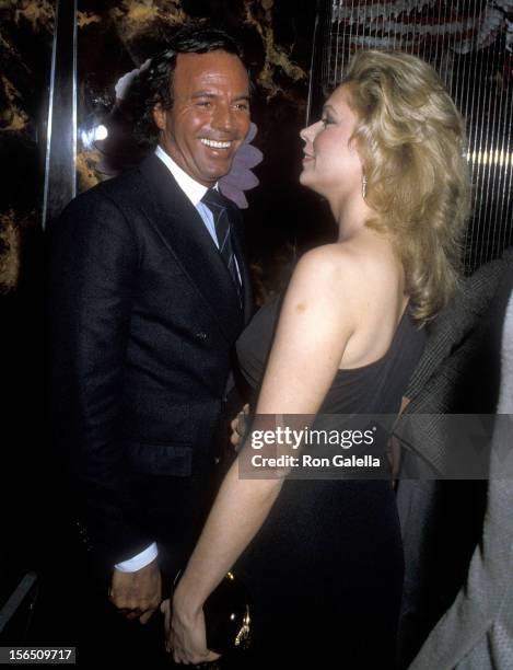 Singer Julio Iglesias and singer Leonore O'Malley attend Regine Zylberberg's Pre-Valentine's Day Party on February 13, 1982 at Regine's in New York...