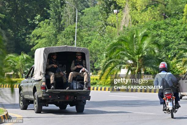 Pakistani army soldiers patrol along the constitution avenue ahead of the visit of Chinese Vice Premier He Lifeng, in Islamabad on July 30, 2023. He...