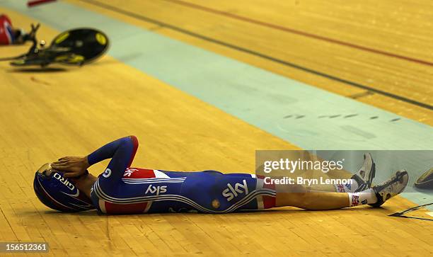 Joesph Kelly of Great Britain lies on the track after crashing during qualifying in the Men's Team Pursuit during day one of the UCI Track Cycling...