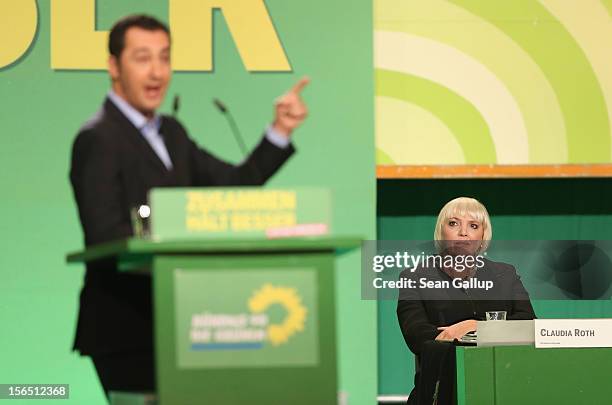 German Greens Party co-chairwoman Claudia Roth looks on as co-chairman Cem Oezdemir speaks to delegates at the Greens Party federal convention on...