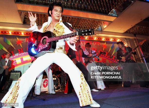 Thai rock singers impersonate the late Elvis Presley during a memorial party for American king of rock and roll, late 15 August 2000 at a Bangkok...