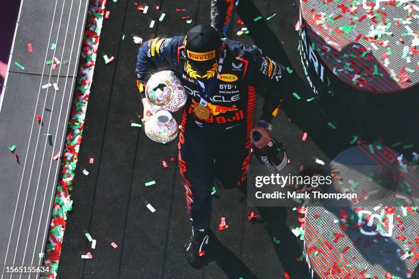 Race winner Max Verstappen of the Netherlands and Oracle Red Bull Racing celebrates on the podium during the F1 Grand Prix of Hungary at Hungaroring...
