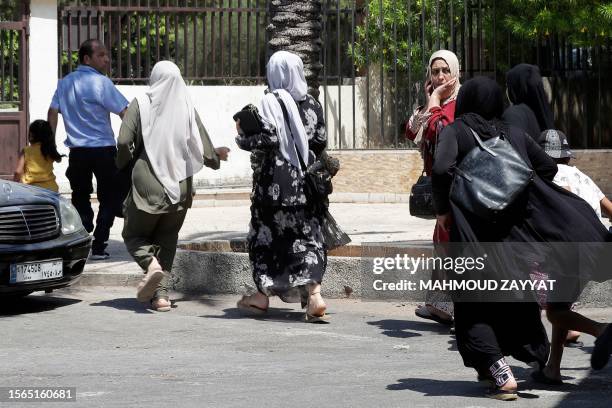 Palestinian families evacuates their homes in the Ain el-Helweh Palestinian refugee camp, Lebanon's largest Palestinian refugee camp, during clashes...