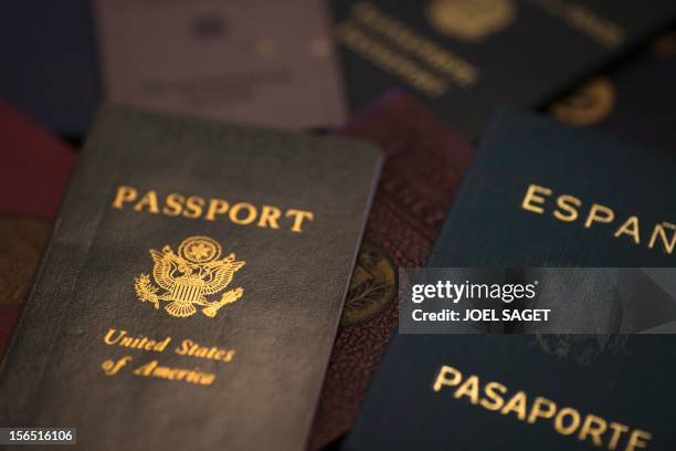 Picture taken on November 16, 2012 in Paris shows fake passports at Argentina's born and French photographer, Adolfo Kaminsky's home. Born in a...