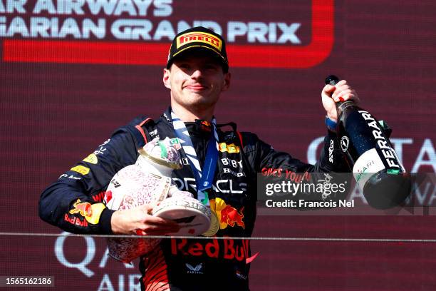 Race winner Max Verstappen of the Netherlands and Oracle Red Bull Racing celebrates on the podium during the F1 Grand Prix of Hungary at Hungaroring...