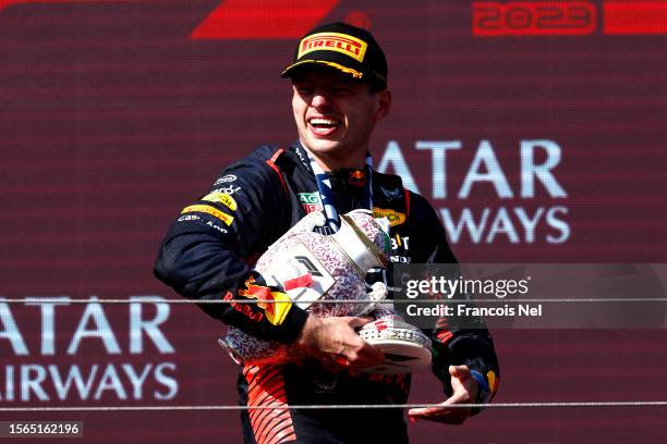 Race winner Max Verstappen of the Netherlands and Oracle Red Bull Racing celebrates on the podium during the F1 Grand Prix of Hungary at Hungaroring...