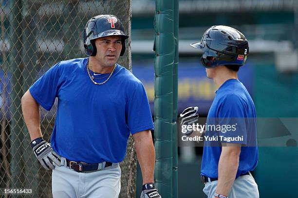 Johnny Damon and Joe Daru of Team Thailand talk during batting practice during the workout day for the 2013 World Baseball Classic Qualifier at...