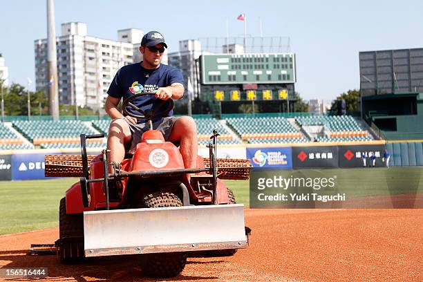 Grounds keeper drags the field before the workout day for Team Thailand for the 2013 World Baseball Classic Qualifier at Xinzhuang Stadium on...