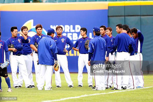 Memebers Team Chinese Taipei are seen getting instruction in the outfield during the workout day for the 2013 World Baseball Classic Qualifier at...