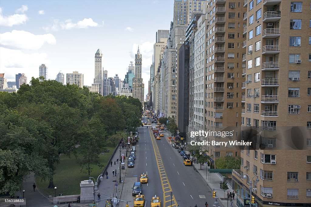 View from above of park, wide street and buildings