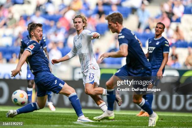 Angelo Stiller of TSG 1899 Hoffenheim, Todd Cantwell of FC Rangers and Marius Buelter of TSG 1899 Hoffenheim battle for the ball during the...