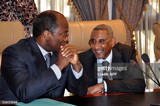 Burkina Faso Minister of Foreign Affairs Djibrill Bassole speaks with advisor to the President of Burkina Faso during a meeting between lead...