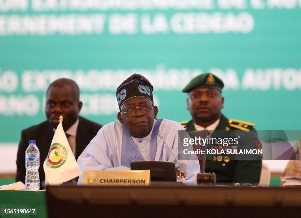 Chairperson of Economic Community of West African States and President of Nigeria, Bola Ahmed Tinubu, reacts while addressing the ECOWAS head of...
