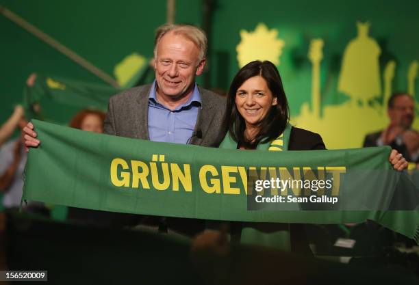 German Greens Party co-chancellor candidates Katrin Goering-Eckardt and Juergen Trittin hold up a banner that reads: "Green Wins" after both spoke at...