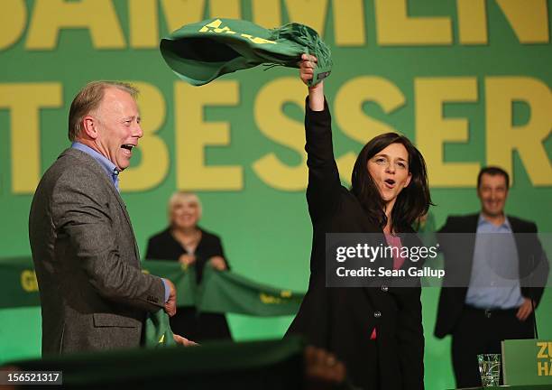 German Greens Party co-chancellor candidates Katrin Goering-Eckardt and Juergen Trittin celebrate after both spoke at the Greens party federal...