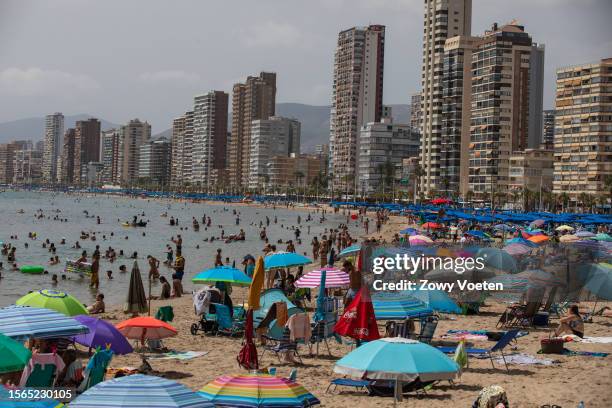 Bathers enjoying the beach on general election day on July 23, 2023 in Benidorm, Spain. Voters in Spain head to the polls on July 23 to cast their...