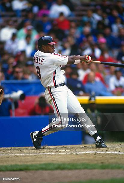 Albert Belle of the Cleveland Indians bats against the Oakland Athletics during an Major League Baseball game circa 1990 at Cleveland Stadium in...