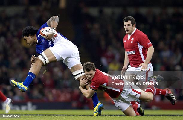 Wales' left wing George North tackles Samoa's left wing David Lemi during their International Rugby Union match at The Millennium Stadium in Cardiff,...