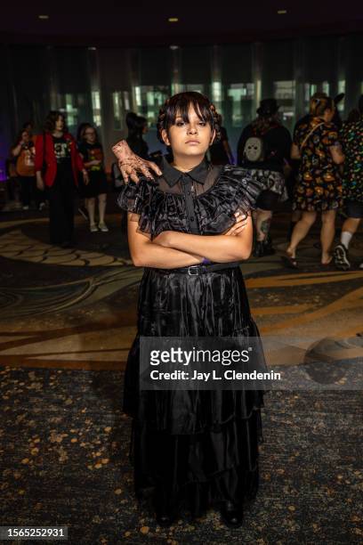 Long Beach, CA Marilyn Morales from Gardena, dressed in cosplay as Wednesday Adams, attending her sixth Midsummer Scream, a Halloween and horror...
