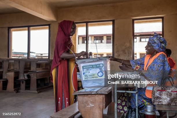 Voter casts her ballot at the Gbaya Dombia school in Bangui, on July 30, 2023. The Central African Republic began voting on Sunday in a referendum on...