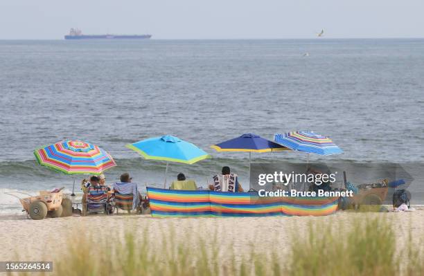 As hot and humid weather continued into the weekend, visitors populated the beach on July 22, 2023 in Long Beach, New York.