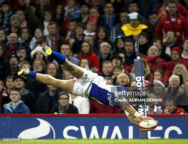 Samoa's centre George Pisi dives to score a try against Wales during their International Rugby Union match at The Millennium Stadium in Cardiff,...