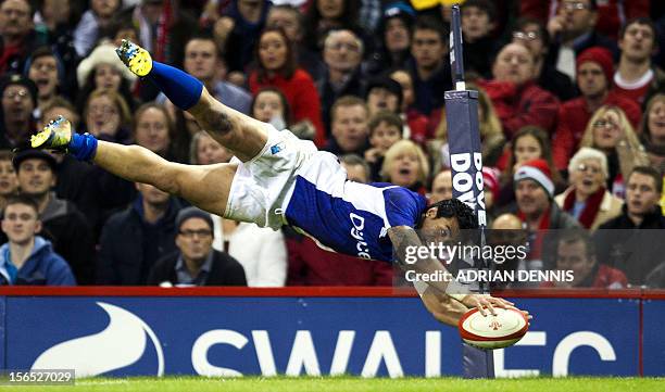 Samoa's centre George Pisi dives to score a try against Wales during their International Rugby Union match at The Millennium Stadium in Cardiff,...