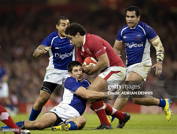 Samoa's Johnny Leota tackles Wales' Toby Faletau during their International Rugby Union match at The Millennium Stadium in Cardiff, Wales, on...