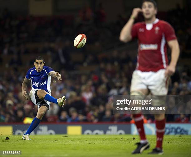 Samoa's Fly Half Tusiata Pisi kicks a penalty against Wales during their International Rugby Union match at The Millennium Stadium in Cardiff, Wales,...