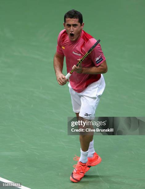 Nicolas Almagro of Spain celebrates a point against Tomas Berdych of Czech Republic during day one of the final Davis Cup match between Czech...