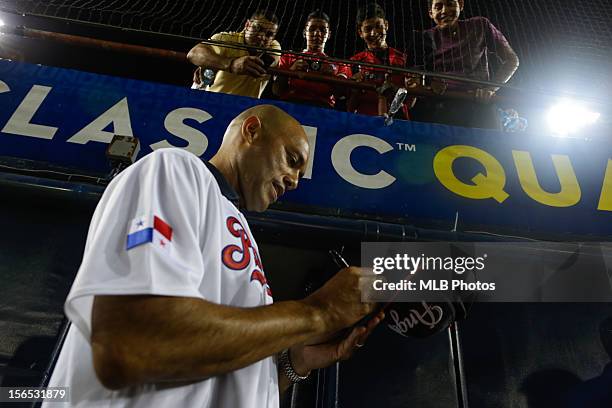 Panama native Mariano Rivera of the New York Yankees signs autographs before Game 1 of the 2013 World Baseball Classic Qualifier between Team Brazil...