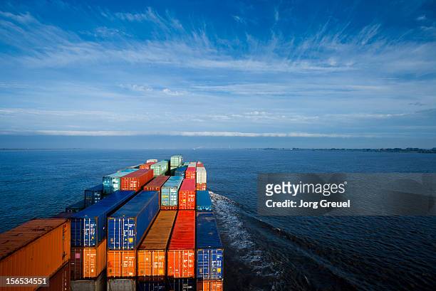 container ship on elbe river - ship stock-fotos und bilder