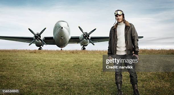 retro pilot and his airplane - aviation hat stock pictures, royalty-free photos & images