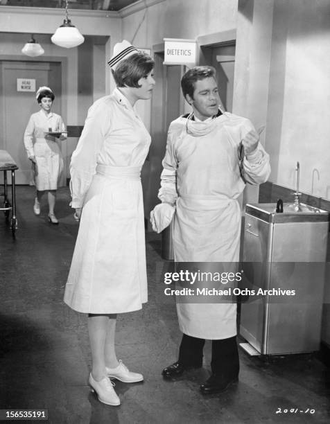 Bea Bradley questions Doug McClure in a scene from the film 'Nobody's Perfect', 1968.