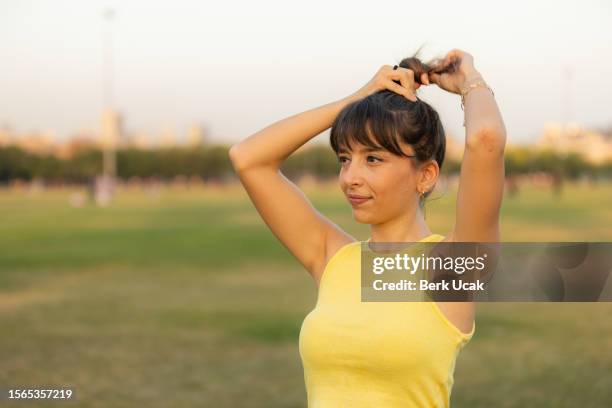 portrait of young beautiful woman in a sports suit. - armpit stock pictures, royalty-free photos & images