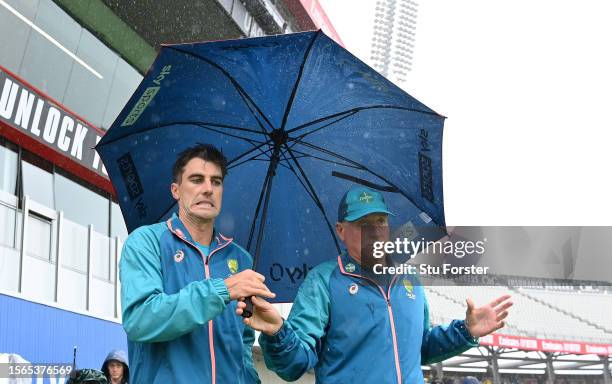 Australia captain Pat Cummins with umbrella in the rain after day five of the LV= Insurance Ashes 4th Test Match between England and Australia at...
