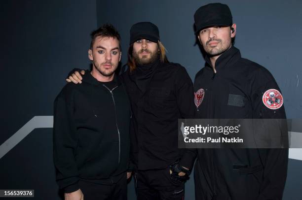 Portrait of American rock band 30 Seconds to Mars backstage at the Aragon Ballroom, Chicago, Illinois, March 16, 2007. Pictured are, from left,...